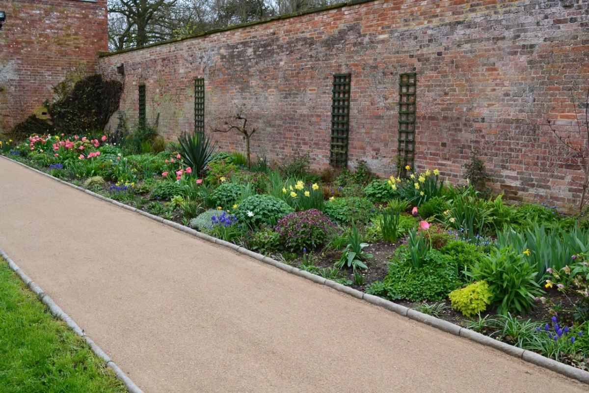 Centrack path alongside a walled garden border