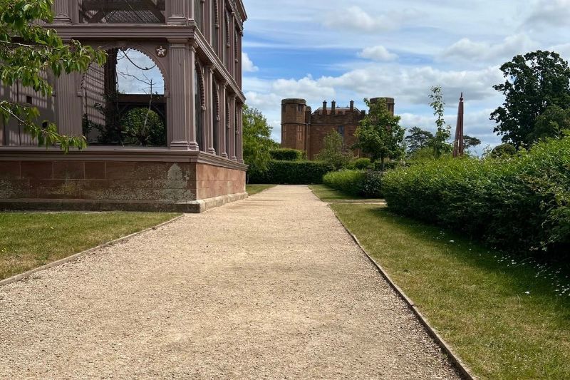 Centrack pathway beside a historic house